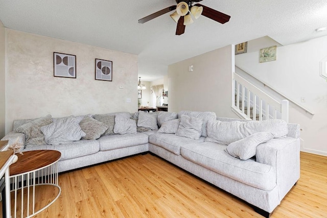2387 King Arthurs Ct, Harrisonburg, VA 22801 - living room featuring ceiling fan, wood finished floors, and stairs