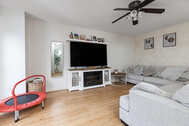 2387 King Arthurs Ct, Harrisonburg, VA 22801 - living room featuring wood finished floors, ceiling fan, and a textured ceiling