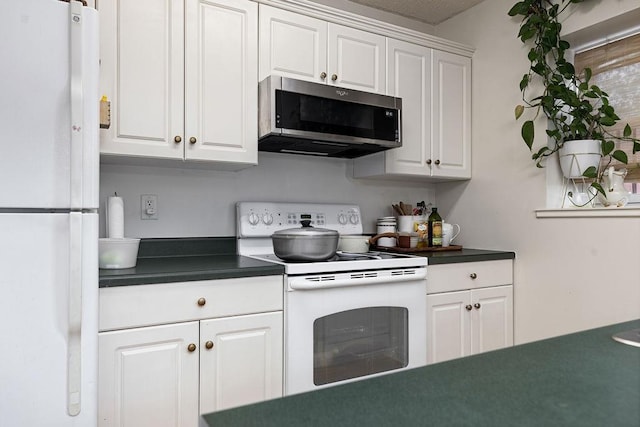 2387 King Arthurs Ct, Harrisonburg, VA 22801 - kitchen featuring white appliances, dark countertops, and white cabinetry