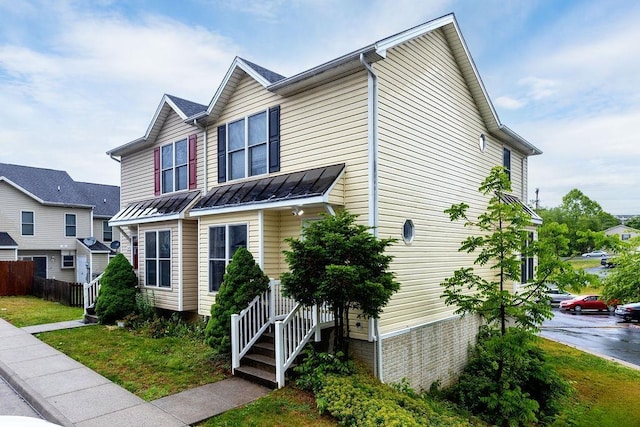 2387 King Arthurs Ct, Harrisonburg, VA 22801 - townhome / multi-family property with a standing seam roof, metal roof, and fence