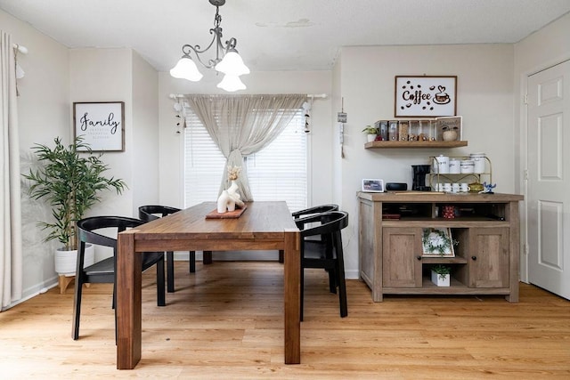2387 King Arthurs Ct, Harrisonburg, VA 22801 - dining space featuring a chandelier, light wood-style floors, and a desk