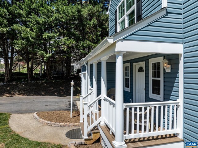 276 Rustling Oaks Way, Ruckersville, VA 22968 - doorway to property featuring covered porch