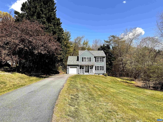 276 Rustling Oaks Way, Ruckersville, VA 22968 - view of front of home with covered porch, asphalt driveway, a front yard, and a garage
