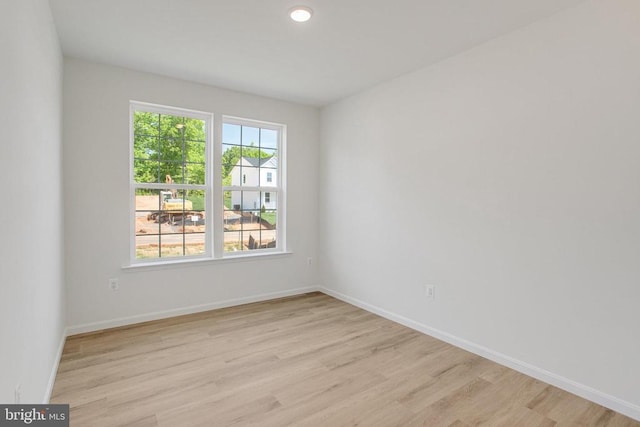 35614 Pine Needle Ln, Locust Grove, VA 22508 - spare room with light wood-type flooring and baseboards