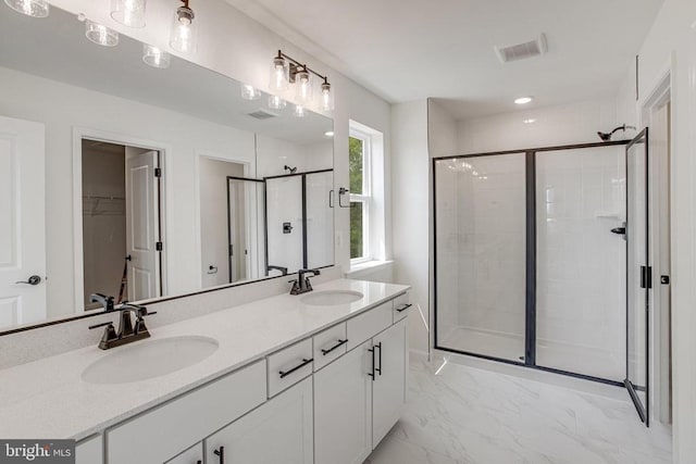 35614 Pine Needle Ln, Locust Grove, VA 22508 - full bathroom featuring a shower stall, double vanity, a walk in closet, and marble finish floors
