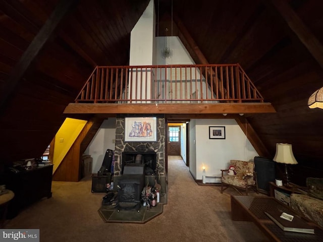 20 Victory Ln, Castleton, VA 22716 - carpeted living room with wood ceiling, a baseboard heating unit, a wood stove, high vaulted ceiling, and wooden walls