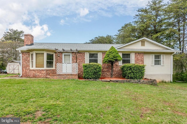 single story home featuring a chimney, an outbuilding, a front lawn, and a storage unit