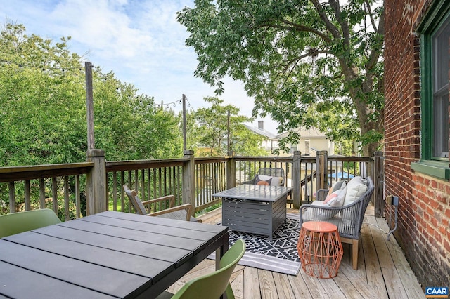 deck with outdoor dining space and outdoor lounge area