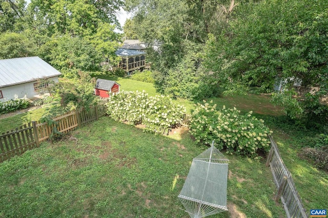 view of yard with a shed and an outdoor structure