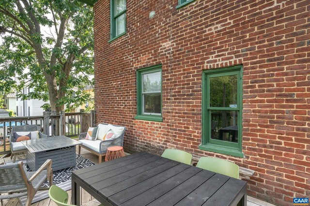 deck featuring outdoor lounge area