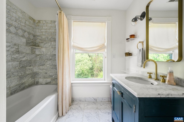 full bathroom featuring marble finish floors, vanity, and shower / bath combo