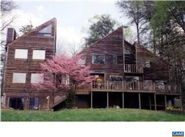 301 Gillums Ridge Rd, Charlottesville, VA 22903 - rear view of house featuring a wooden deck and a chimney