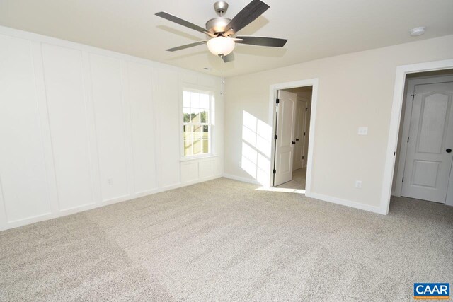 unfurnished bedroom featuring a ceiling fan and carpet floors