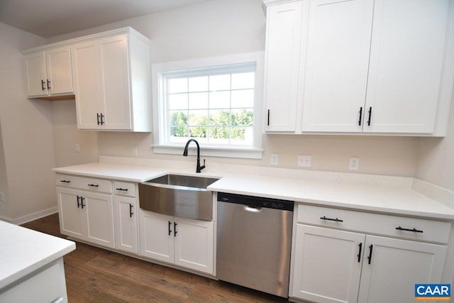 kitchen with a sink, white cabinetry, dark wood-style flooring, light countertops, and dishwasher