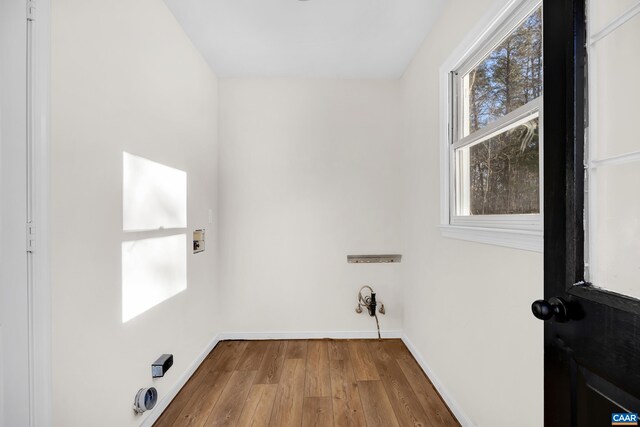 laundry area with hookup for a washing machine and hardwood / wood-style floors