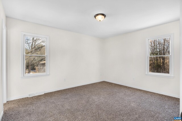 empty room with carpet flooring