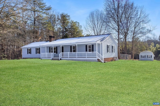 view of front facade with a storage unit, covered porch, and a front lawn