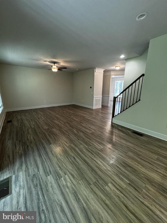102 Monroe St, Locust Grove, VA 22508 - unfurnished living room with ceiling fan, stairway, dark wood-type flooring, and recessed lighting