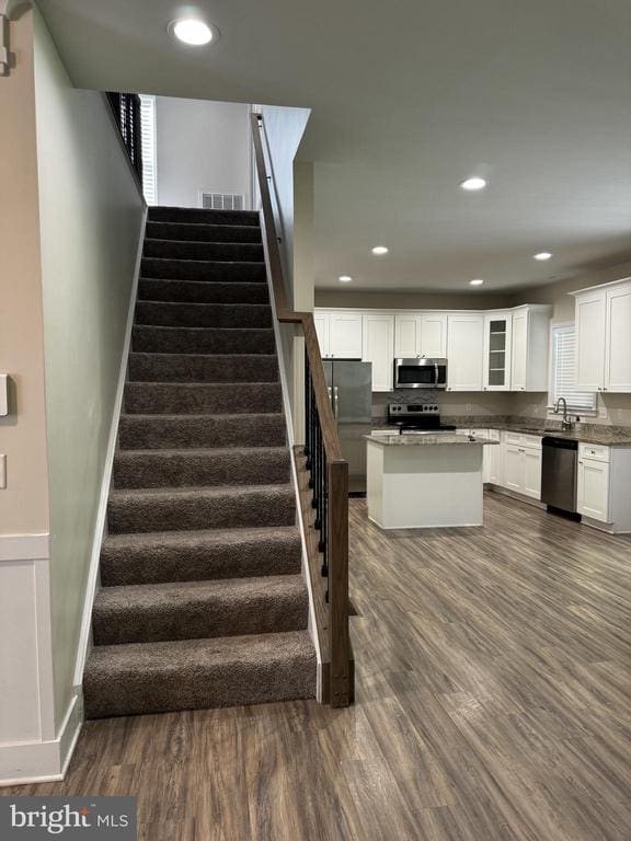102 Monroe St, Locust Grove, VA 22508 - stairs featuring wood finished floors and recessed lighting