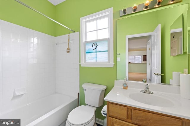 full bath with toilet, vanity, and bathtub / shower combination