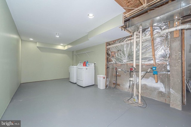  - unfinished basement with separate washer and dryer, recessed lighting, and drainage system