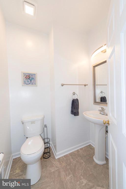  - bathroom featuring toilet and baseboards
