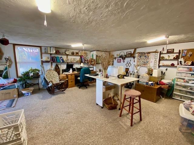 carpeted home office with a textured ceiling