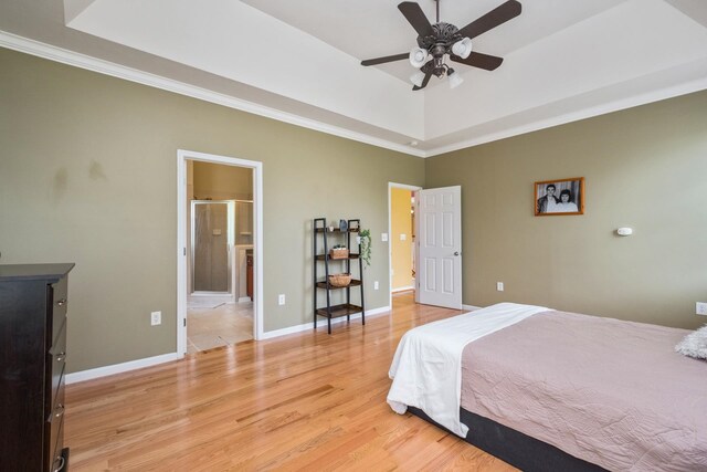 11 Tradewind Cir, Fishersville, VA 22939 - bedroom featuring ornamental molding, light wood-style flooring, baseboards, a raised ceiling, and connected bathroom