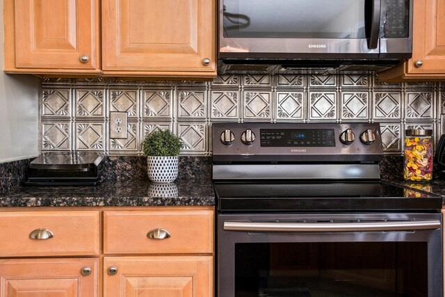 11 Tradewind Cir, Fishersville, VA 22939 - kitchen featuring appliances with stainless steel finishes, backsplash, dark stone counters, and light brown cabinets
