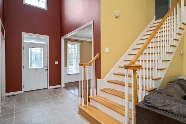 11 Tradewind Cir, Fishersville, VA 22939 - foyer with plenty of natural light, baseboards, stairs, a high ceiling, and ornamental molding