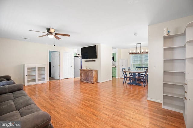167 Fairview Rd, Louisa, VA 23093 - living area with a ceiling fan, light wood finished floors, and a chandelier
