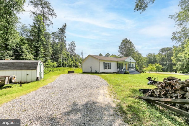 167 Fairview Rd, Louisa, VA 23093 - view of front facade featuring gravel driveway, a front lawn, and a shed