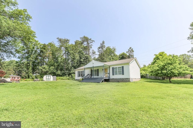 167 Fairview Rd, Louisa, VA 23093 - view of front of home featuring a storage shed, a front yard, covered porch, crawl space, and view of scattered trees