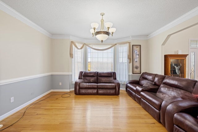 635 Long Meadow Rd, Fishersville, VA 22939 - living room featuring a healthy amount of sunlight, light wood finished floors, a textured ceiling, and a chandelier