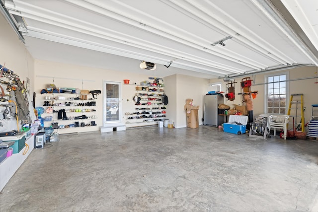 635 Long Meadow Rd, Fishersville, VA 22939 - garage with freestanding refrigerator and a garage door opener