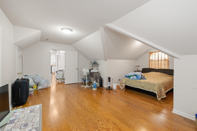 635 Long Meadow Rd, Fishersville, VA 22939 - bedroom with lofted ceiling, a textured ceiling, and light wood-style floors