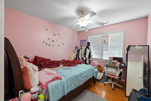 635 Long Meadow Rd, Fishersville, VA 22939 - bedroom with a ceiling fan, a textured ceiling, and wood finished floors