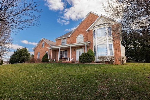 635 Long Meadow Rd, Fishersville, VA 22939 - traditional-style house with a porch, brick siding, and a front lawn