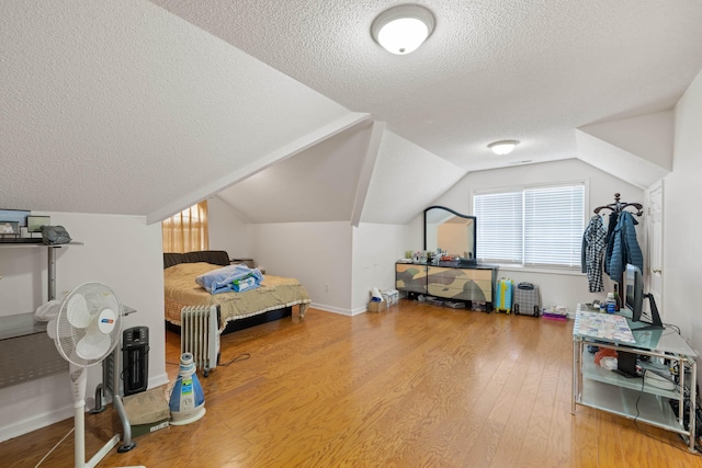 635 Long Meadow Rd, Fishersville, VA 22939 - bedroom with a textured ceiling, baseboards, wood finished floors, and lofted ceiling