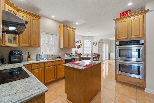 635 Long Meadow Rd, Fishersville, VA 22939 - kitchen with a center island, under cabinet range hood, a sink, decorative backsplash, and black appliances