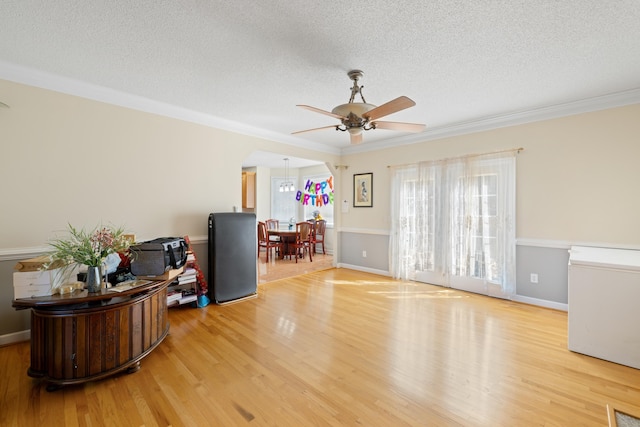 635 Long Meadow Rd, Fishersville, VA 22939 - interior space with crown molding, a textured ceiling, baseboards, ceiling fan, and light wood-style floors