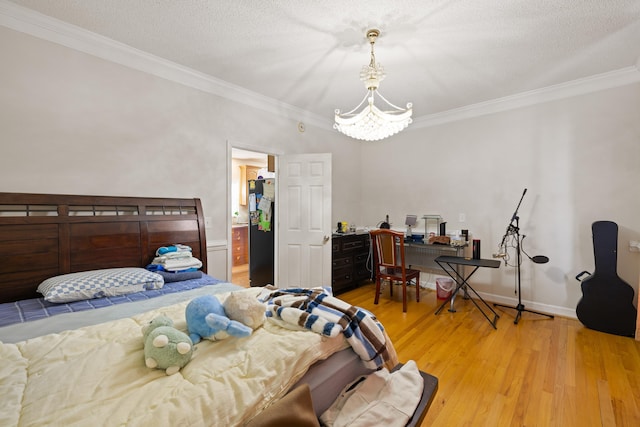 635 Long Meadow Rd, Fishersville, VA 22939 - bedroom with an inviting chandelier, light wood-style floors, baseboards, and ornamental molding
