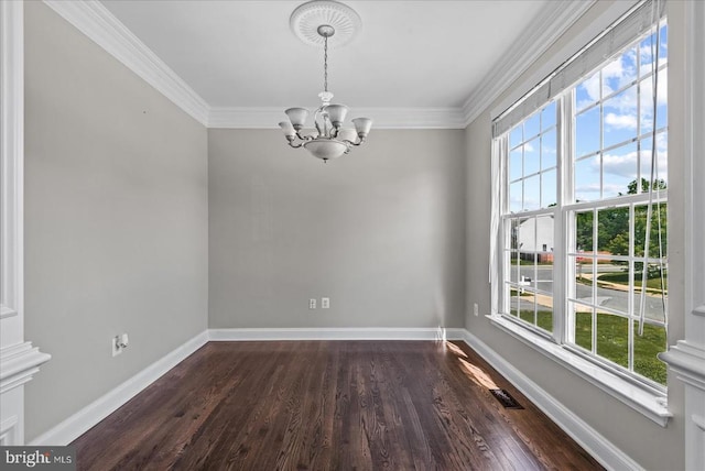 6903 Quitman Dr, Fredericksburg, VA 22407 - spare room with healthy amount of natural light, a chandelier, dark wood-type flooring, and ornamental molding