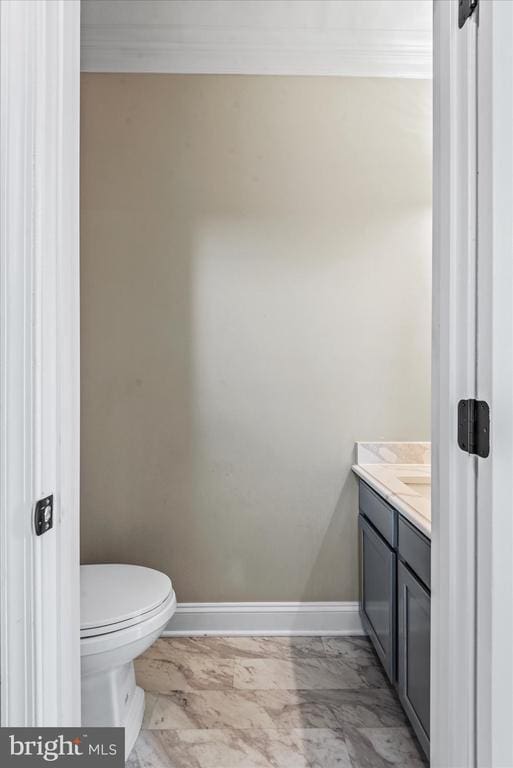 6903 Quitman Dr, Fredericksburg, VA 22407 - half bathroom with marble look tiles, vanity, baseboards, and toilet
