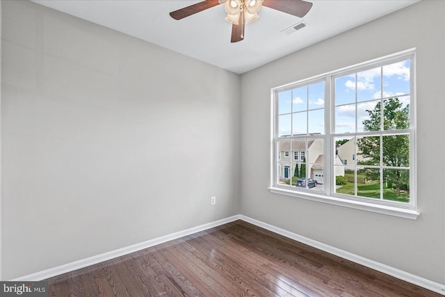 6903 Quitman Dr, Fredericksburg, VA 22407 - empty room featuring baseboards, healthy amount of natural light, dark wood finished floors, and ceiling fan