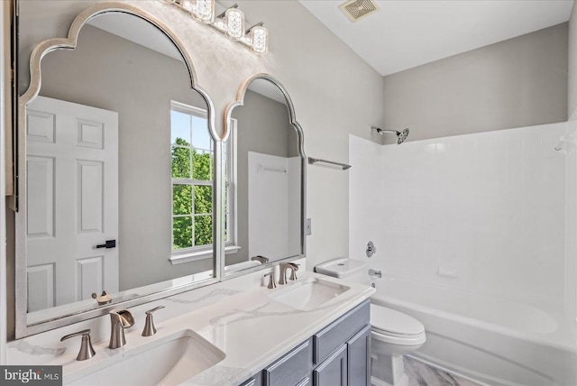 6903 Quitman Dr, Fredericksburg, VA 22407 - bathroom featuring toilet, bathtub / shower combination, and double vanity