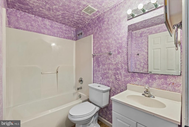 6903 Quitman Dr, Fredericksburg, VA 22407 - full bath featuring toilet, vanity, wallpapered walls, and shower / bath combination