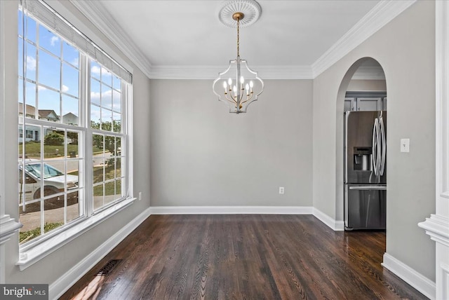 6903 Quitman Dr, Fredericksburg, VA 22407 - unfurnished dining area with healthy amount of natural light, dark wood-type flooring, arched walkways, a chandelier, and ornamental molding