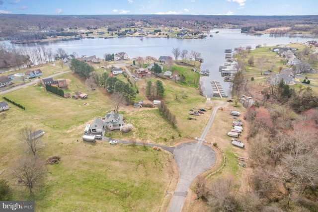 aerial view of property and surrounding area with a large body of water