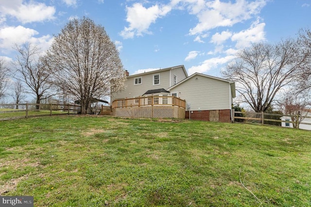 back of house featuring a deck